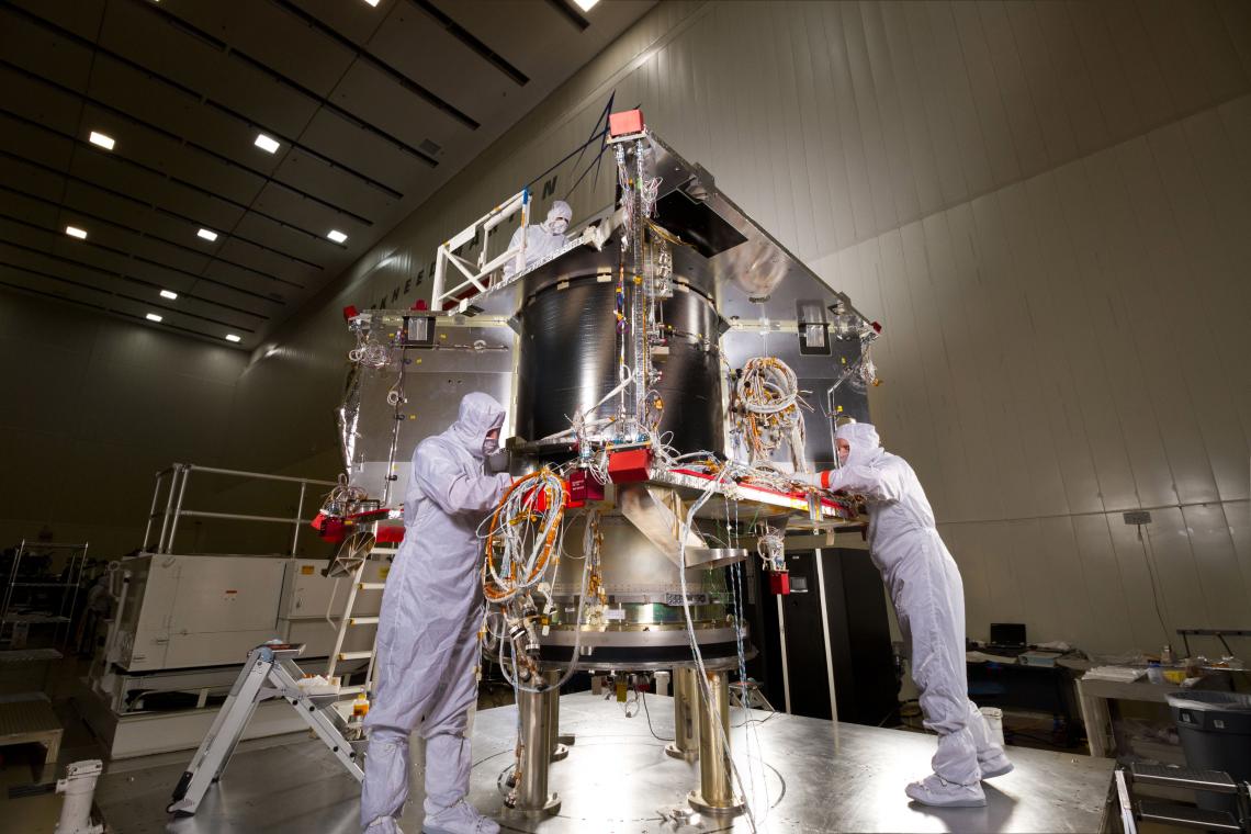 In a clean room facility near Denver, Lockheed Martin technicians continue assembling NASA’s OSIRIS-Rex spacecraft that will collect samples of an asteroid. In a clean room facility near Denver, Lockheed Martin technicians continue assembling NASA’s OSIRIS-Rex spacecraft that will collect samples of an asteroid.